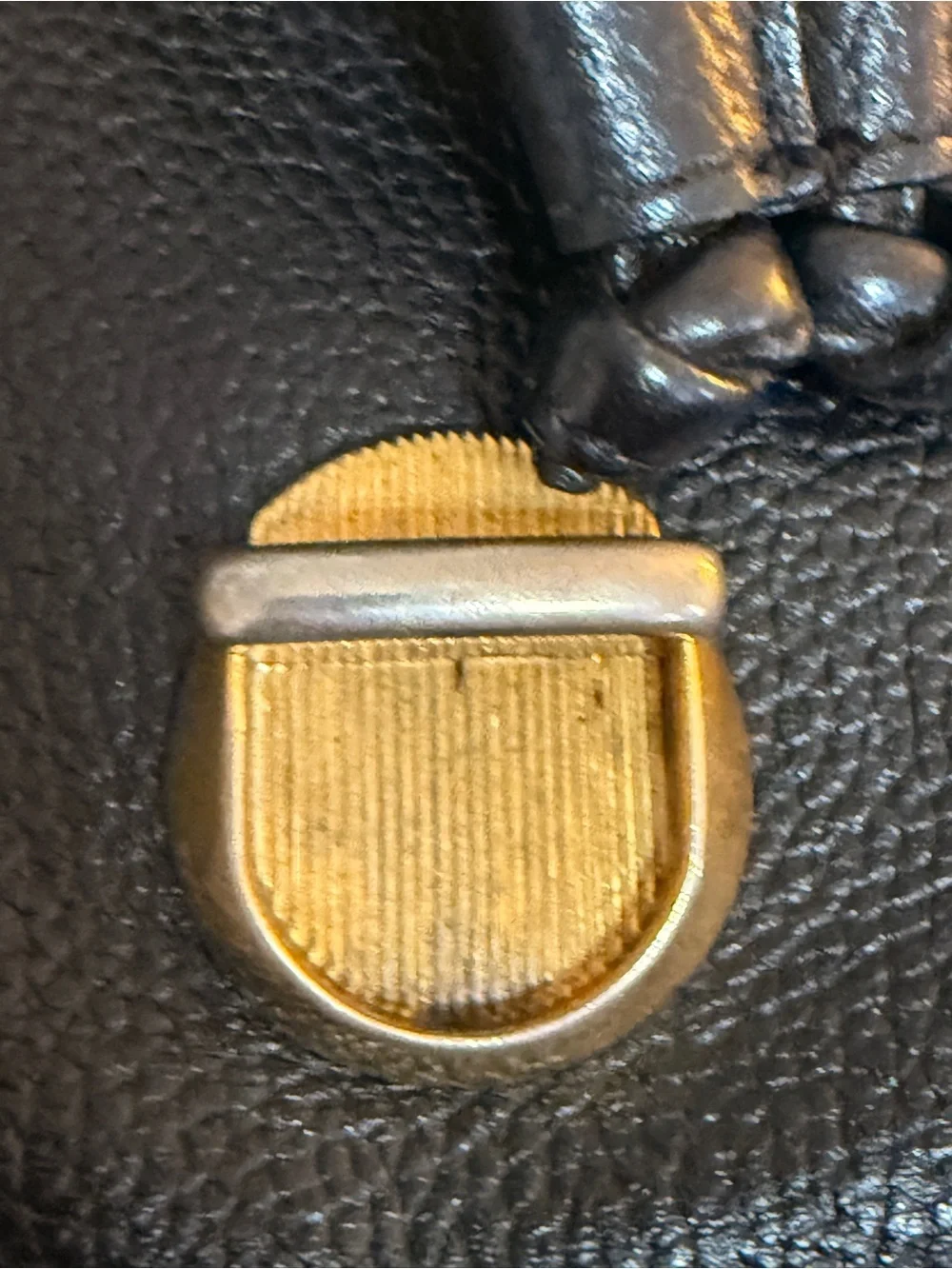 MCM Black Leather Backpack with Gold Accents and Front Pockets